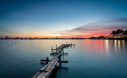 the wooden bridges on the lake in the sunset