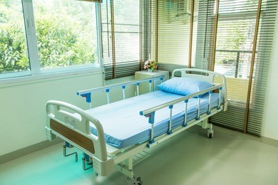 empty bed on hospital ward 