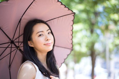 beautiful young woman with parasol
