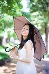 beautiful young woman with parasol