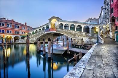 morning twilight grand canal and rialto bridge in venice, italy