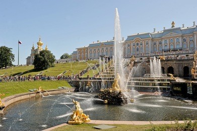 view of the grand palace and the cascade of fountains in peterhof, russia