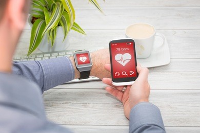 businessman uses smart watch and phone. smartwatch concept.