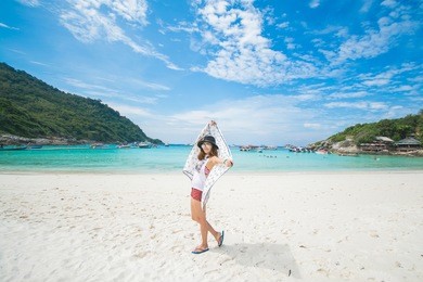 woman happy when her travel to racha island, phuket thailand, nature