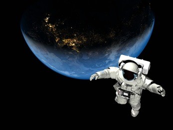 astronaut flying over the planet."elemen ts of this image furnished by nasa"