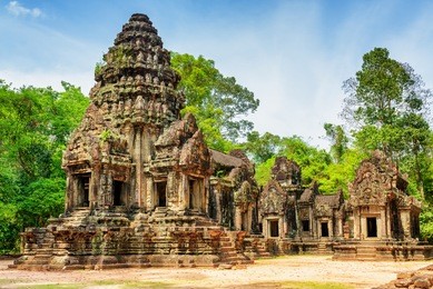 view of main tower of ancient thommanon temple in amazing angkor, siem reap, cambodia. mysterious thommanon nestled among rainforest. enigmatic angkor is a popular tourist attraction.