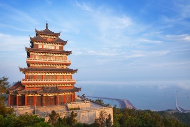 beautiful ancient temple on the seaside with blue sky and fog, dongtou island, wenzhou, zhejiang province, china