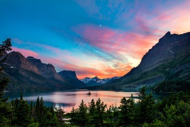 beautiful colorful sunset over st. mary lake and wild goose island in glacier national park