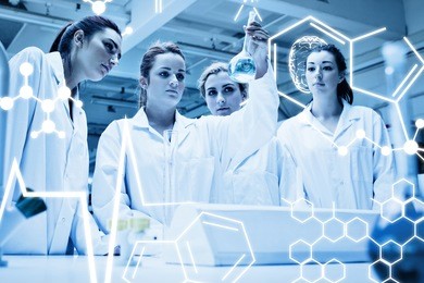 chemistry students looking at a liquid against science graphic