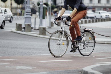 low angle of a casual man on bike 