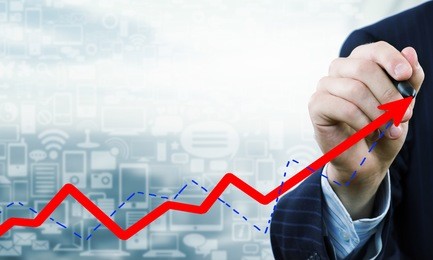 close up of businessman drawing increasing graph with marker on media screen