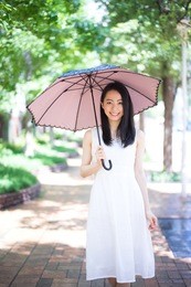 beautiful young woman with parasol