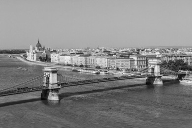 the famous chain bridge (1849) is a suspension bridge that spans the river danube between buda and pest. budapest, hungary, europe. black and white.