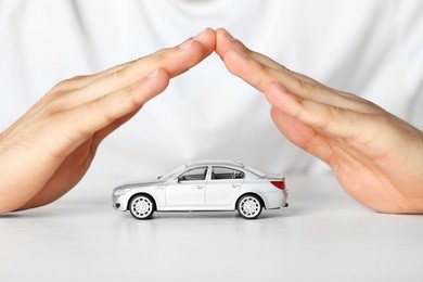 male hands and car as protection of car concept