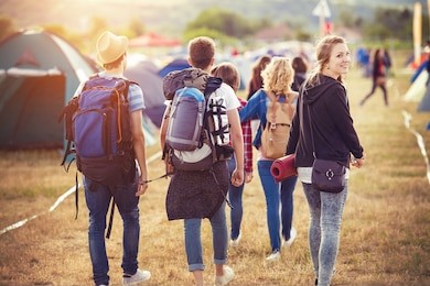 group of beautiful teens arriving at summer festival