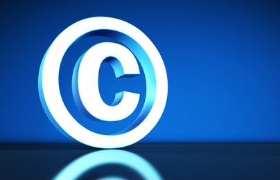 intellectual property and digital copyright laws conceptual illustration with copyright symbol and icon on blue background.