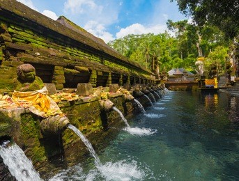holy spring water in tirta empul temple, bali, indonesia