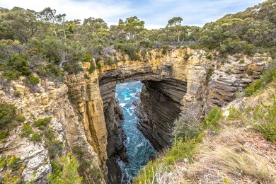 tasman arch is an unusual geological formation found in the tasman national park, tasman peninsula in the south east coast of tasmania, australia.