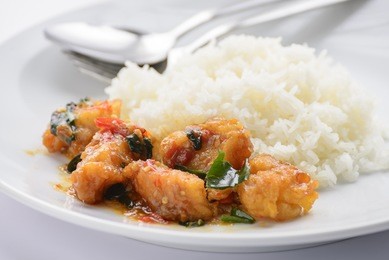 fried fish with chilli sauce and cooked rice