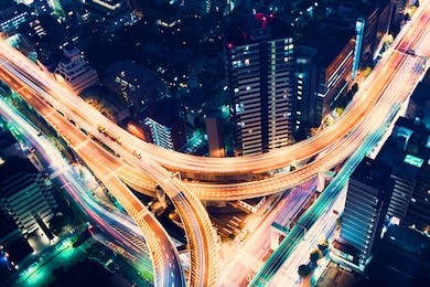 aerial view of a massive highway intersection at night in shinjuku, tokyo, japan