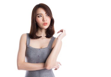 beautiful young asian woman thinking and looking to copy space, isolated on white background