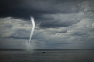 bad weather and the storm with the wind on the sea. tornado over the ocean
