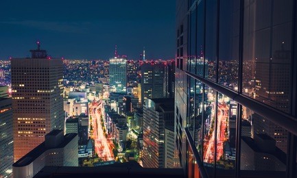 aerial view of a massive highway intersection at night in shinjuku, tokyo, japan from a skyscraper