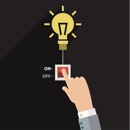 turn on idea, representing with hand pushing on button on for bright light bulb.