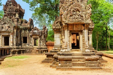 doorway with carving of ancient thommanon temple in enigmatic angkor, siem reap, cambodia. mysterious thommanon nestled among rainforest. amazing angkor is a popular tourist attraction.