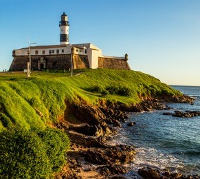 view of farol da barra lighthouse in salvador, bahia, brazil on a sunny summer day.