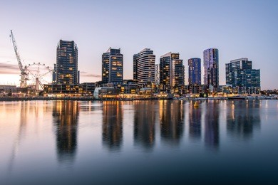 the reflection of docklands waterfront area in melbourne at night, australia.