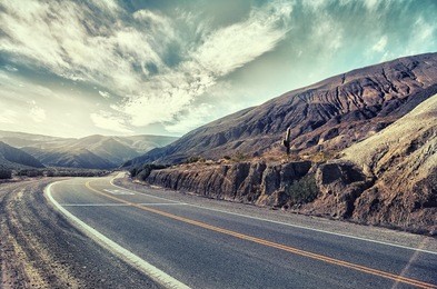 cinematic road landscape. humahuaca valley, altiplano, argentina. misty road. mist. cross-processed. vintage style. instagram filter.