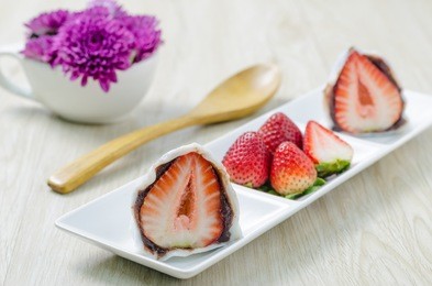 strawberry mochi, ichigo daifuku on wooden board.