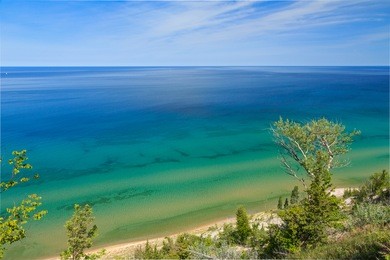 lake michigan is viewed from high atop a sand dune bluff midway between frankfort and manistee, michigan.