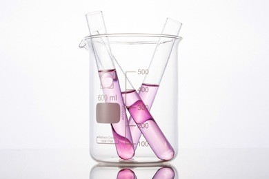 test tube with red(blood, magenta, pink) liquid(fluid, water) in the beaker for chemical, health at the laboratory and white background.