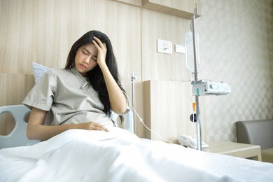 patients lying in the room. she had severe headaches