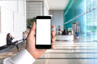 blank card cell phone smartphone hand pov business man background workplace office perspective point of view