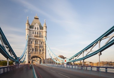 long exposure shot of the tower bridge in london with blue sky.