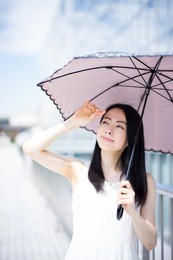 beautiful young woman with parasol