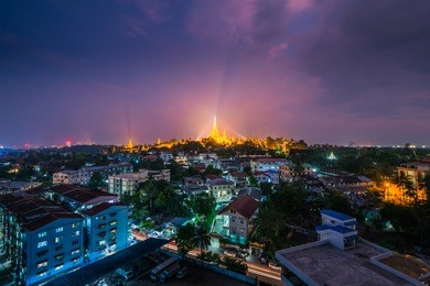 shwedagon pagoda glowing at night, yangon, rangoon, myanmar