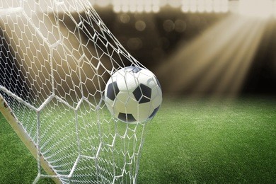 soccer ball in goal with spotlight