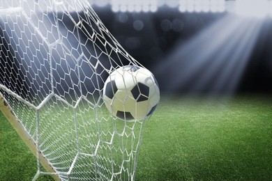 soccer ball in goal with spotlight