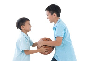 asian kids playing basketball
