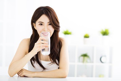 young attractive woman with clean water
