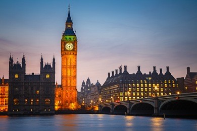 big ben and westminster bridge at dusk in london