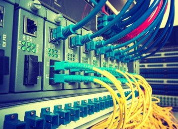 fiber optic cables connected to an optic ports