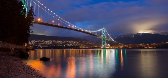 night shot of lions gate bridge and grouse mountain