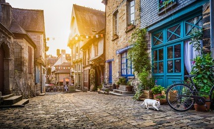panoramic view of old town in europe in beautiful evening light at sunset with retro vintage instagram style grunge filter and lens flare effect