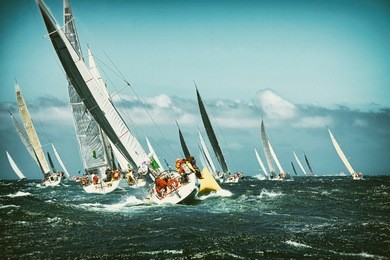 sailing yacht in the regatta. toned image and blur. retro style postcard. sailing. yachting.