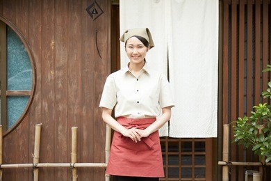 smiling japanese restaurant clerk outdoor